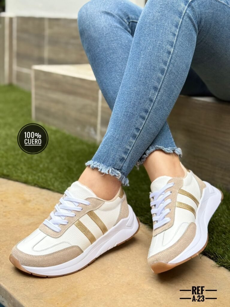 Zapatillas en cuero para mujer con suela deportiva y detalles en gamuza. Cómodas, modernas y perfectas para uso diario.
