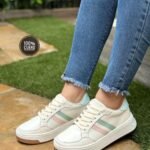 Zapatillas en cuero para mujer con diseño pastel y suela deportiva. Cómodas, modernas y perfectas para uso diario.